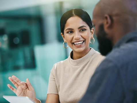 Woman smiling looking at colleague