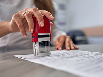 Woman stamping a legal document